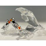 A Swarovski Crystal model, The Eagle, 10cm high, boxed; others, a parrot, boxed; a pair of