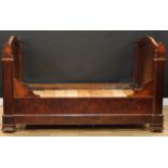 A 19th century French provincial walnut sleigh bed, 115cm high, 201cm long, 124cm wide, internal