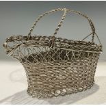 A silver plated wire-work wine cradle