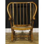 An Irish famine style beech rocking chair, 90cm high, 78cm wide, the seat 46.5cm wide and 48cm deep