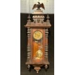 A late 19th century Vienna wall clock, gilt metal Art Nouveau dial, eagle crest, 110cm high