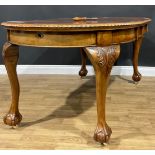A George II style mahogany extending dining table, two additional leaves, 77.5cm high, 111cm