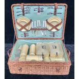 A 1950's Coracle wicker picnic hamper, with contents