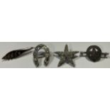 A Victorian silver horseshoe brooch; a silver star brooch; a silver 'With Thanks' Scout badge;