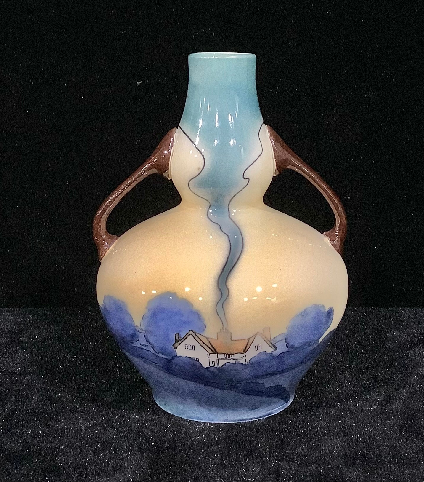 A Foley Pastello gourd shaped two handled vase, pattern number 3548, painted with a cottage and blue