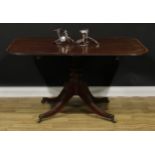 A Regency tulipwood crossbanded mahogany centre table, rounded rectangular tilting top, turned