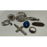 A collection of Victorian/Edwardian silver brooches; a silver ring; crucifix; etc