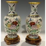 A pair of Chinese cloisonne ovoid vases, decorated in polychrome with roses and butterflies,