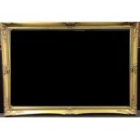 A large gilt framerd rectangular looking glass, bevelled mirror plate, 101cm x 71cm