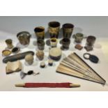 A 19th century copper jelly mould; horn beakers; a collapsible travelling beaker; Cornish serpentine