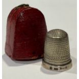 Needlework - a silver thimble, fitted morocco leather case, Birmingham 1917