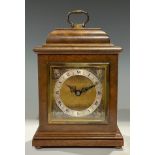 An Elliott walnut mantel clock, in George II Revival taste, retailed by Mappin & Webb