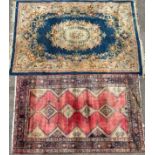 A Middle Eastern woollen rug or carpet, geometric shapes with in a border of stylised geometric
