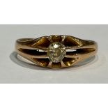 An 18ct gold diamond solitaire gypsy ring, the central irregular brilliant cut stone with vivid