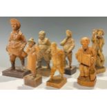 A collection of Black Forest carved figures (7)