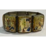 An Indian Mughal silver coloured metal bracelet, set with seven rounded rectangular mother-of-