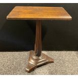 An ‘18th century’ oak tripod occasional table, the unusual pillar carved with swags, triform base,