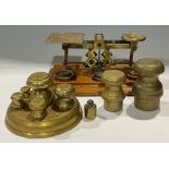 A set of brass graduated "Victoria" weights on stand, 1lb to quarter ounce, two others, 2 and 1lb; a