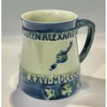 A William Moorcroft commemorative mug, coronation of Edward VII and Queen Alexandra 1902, designed