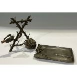 A late 19th century cold painted spelter desk stand, cast as a construction of branches with bird
