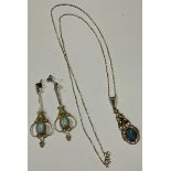 A pair of silver gilt droplet earrings, each set with a polished oval opal cabochon, unmarked,