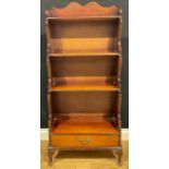 A George III style waterfall bookcase, 131cm high, 61cm wide, 32.5cm deep