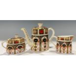 A Royal Crown Derby 1128 Imari pattern bachelor teapot and cover, 14cm high, first quality; a two