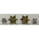 A pair of 18ct gold star shaped earrings, each set with an aquamarine stone, 7g; a pair of