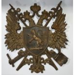 A late 19th/early 20th century cast iron armorial crest, double headed eagle, 38cm high