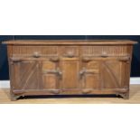 An oak low dresser or sideboard, possibly Rupert/Nigel Griffiths Monastic Woodcraft, 78.5cm high,