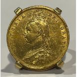 A Victorian gold half sovereign, shield back 1887, mounted in 18ct gold as a signet ring, size I,