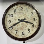 A Bakelite Smiths railway clock, eight day, Arabic numerals, Made in England, 37cm diameter