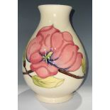 A Moorcroft Magnolia pattern baluster vase, 19cm, impressed and painted marks
