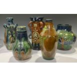 An Belgian Art Pottery four handled sleeve vase, incised decoration with typical Art Nouveau