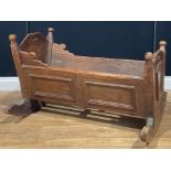 A late Victorian pine and marquetry rocking crib, 59cm high, 93.5cm long, 69.5cm wide