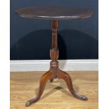 A George III oak tripod occasional table, 69.5cm high, the top 58.5cm diameter