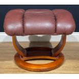 A Global Furniture Alliance footstool, in the manner of Ekornes Stressless, 47cm high, 57cm wide,