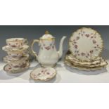 A Royal Crown Derby Royal Royal Antoinette pattern coffee pot, three teacups and saucers, pair of