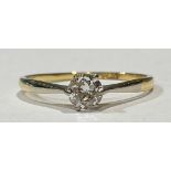 An 18ct gold diamond solitaire ring, round brilliant cut diamond, six claws, raised tapered