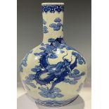 A Chinese bottle vase, decorated in underglaze blue with dragon, 34cm high