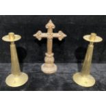 A pair of contemporary ecclesiastical brass altar candlesticks, wide drip pans, tapered column,