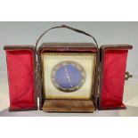 An early 20th century travelling timepiece, blue guilloche enamel dial, Roman numerals on gilt metal