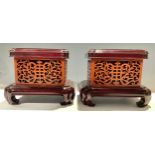A pair of Chinese rounded rectangular hardwood stands, 20.5cm high