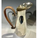 A Spanish steel pitcher, stitched brown leather handle, 27.5cm