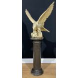 A large Japanese Meiji style cast iron model, of an eagle, 62cm high, 63cm wide; a cast iron