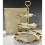 A Royal Albert Old Country Roses pattern three tier cake stand, boxed