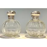 A pair of Edwardian silver mounted fluted globular scent bottles, Birmingham 1903