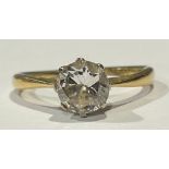 An 18ct gold diamond solitaire ring, the stone approx. 0.7ct, platinum claw set bezel, ring size