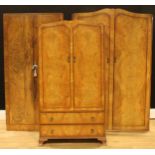 A walnut veneer wardrobe, 180cm high, 91cm wide, 49.5cm deep; two others, 185.5cm high, 121.5cm