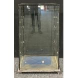 An early 20th century 'ebonised' rectangular shaped glazed floor standing display/shop cabinet,